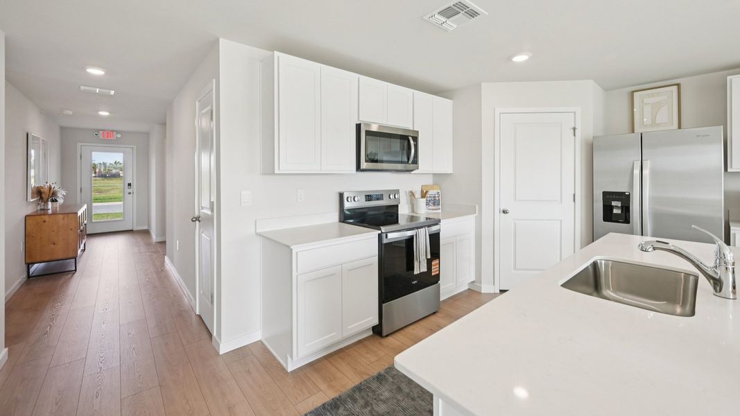 Furnished interior in a model home at Cove at West Port - Express in Port Charlotte (Image 24).