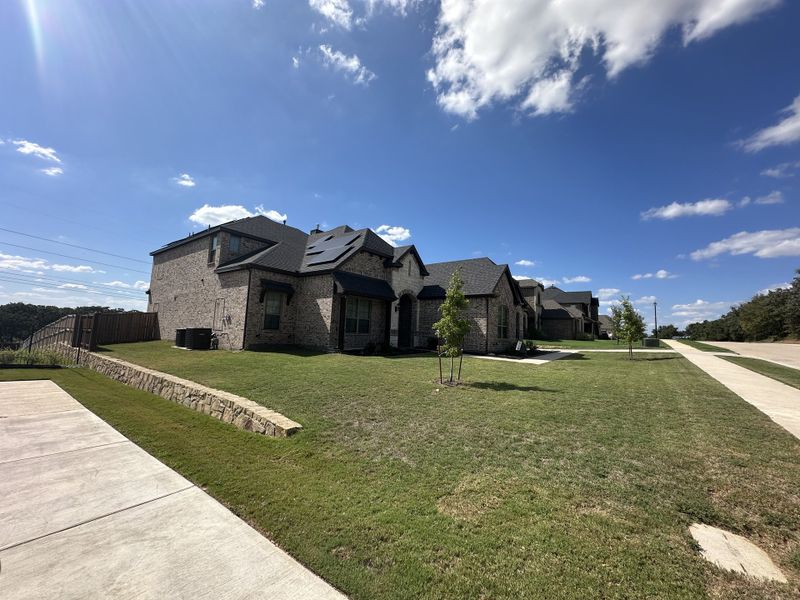A beautiful stone-brick home with manicured lawns in Eagle Estates by GFO Home, Mansfield, TX. A beautiful stone-brick home with manicured lawns in Eagle Estates by GFO Home, Mansfield, TX.