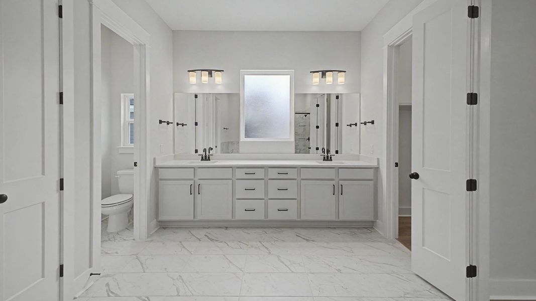 Bathroom with luxury dual vanity, blurred window, and designated area for toilet Bathroom with luxury dual vanity, blurred window, and designated area for toilet