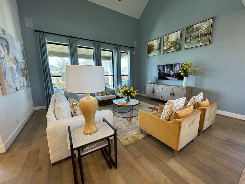 A cozy living room featuring plush seating, modern art, and floor-to-ceiling windows with abundant natural light. A cozy living room featuring plush seating, modern art, and floor-to-ceiling windows with abundant natural light.