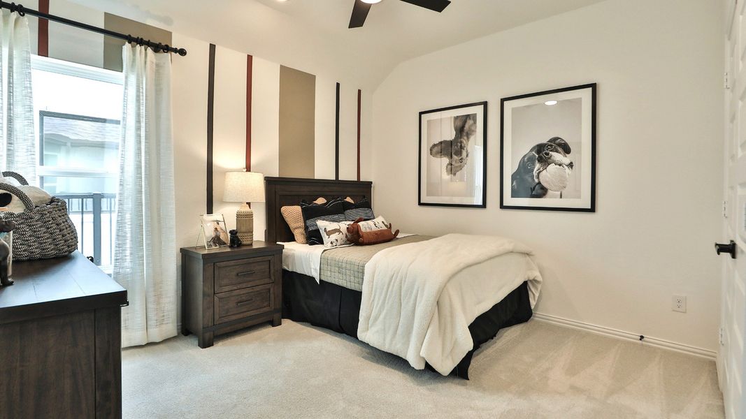 Luxuriously designed bedroom with rich wooden accents and chic artwork in Bridgeland, Texas. Luxuriously designed bedroom with rich wooden accents and chic artwork in Bridgeland, Texas.