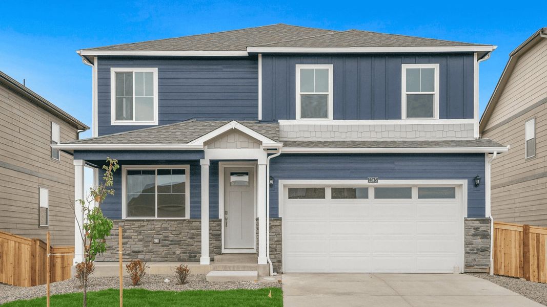 Front exterior of a home in the Settlers Crossing community, located in Commerce City, CO (Image 4). Front exterior of a home in the Settlers Crossing community, located in Commerce City, CO (Image 4).