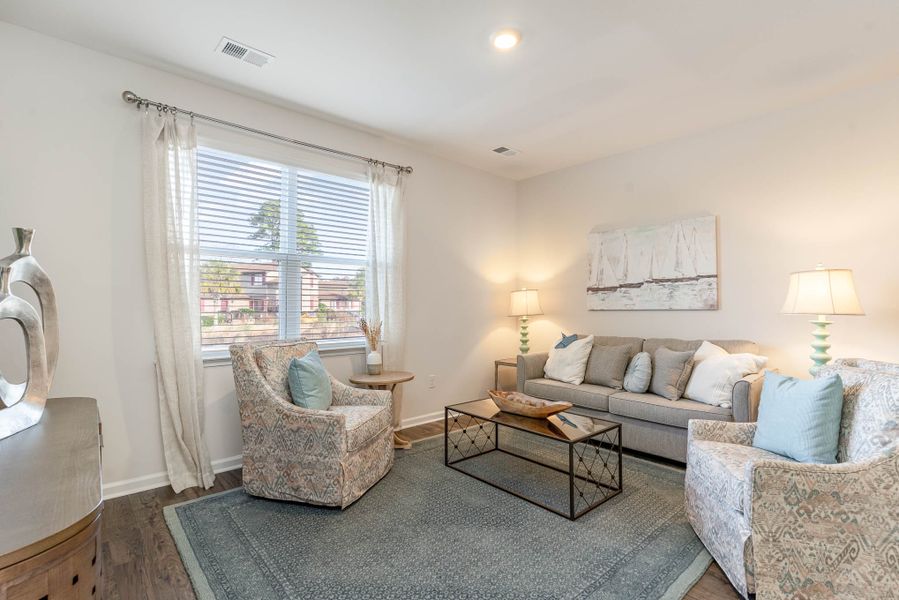 Furnished interior in a model home at Island Green in Myrtle Beach (Image 57).