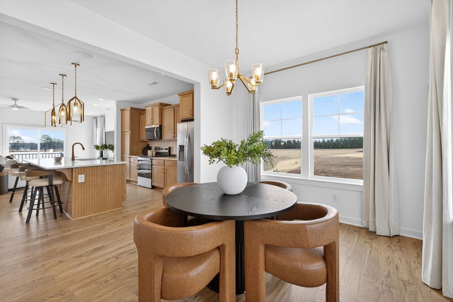 Furnished interior in a model home at North District at Flowers Plantation Townhomes in Clayton (Image 8).