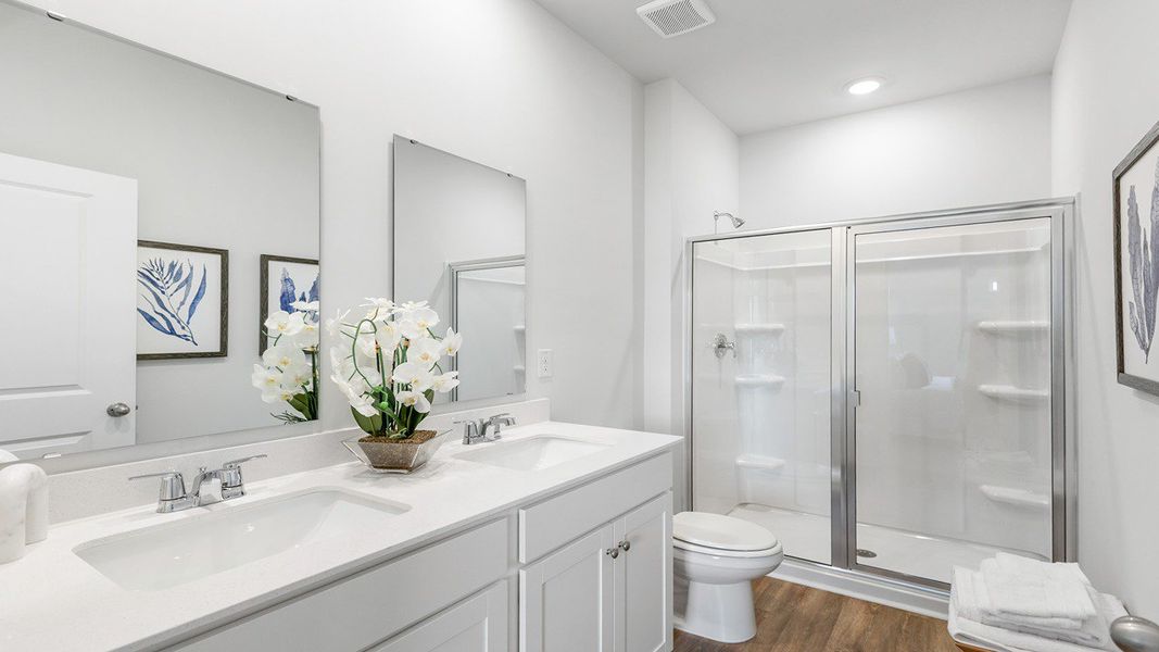 Furnished interior in a model home at The Crossing at St. James in Summerville (Image 16).