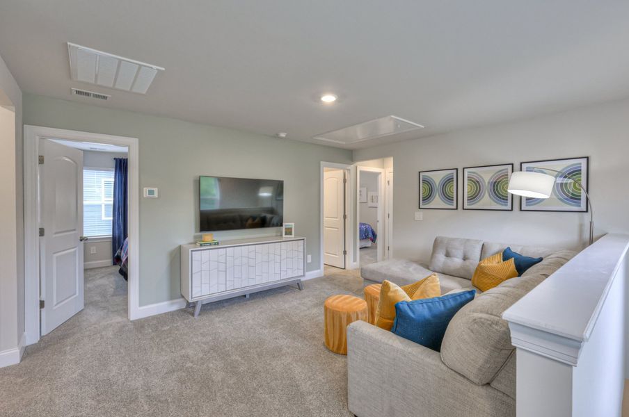 The upstairs loft separates the secondary bedrooms from the primary suite. The upstairs loft separates the secondary bedrooms from the primary suite.