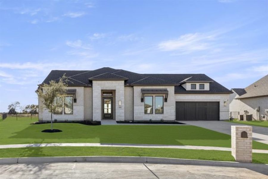 Front exterior of a home in the Heath Golf and Yacht Club community, located in Rockwall, TX (Image 5).
