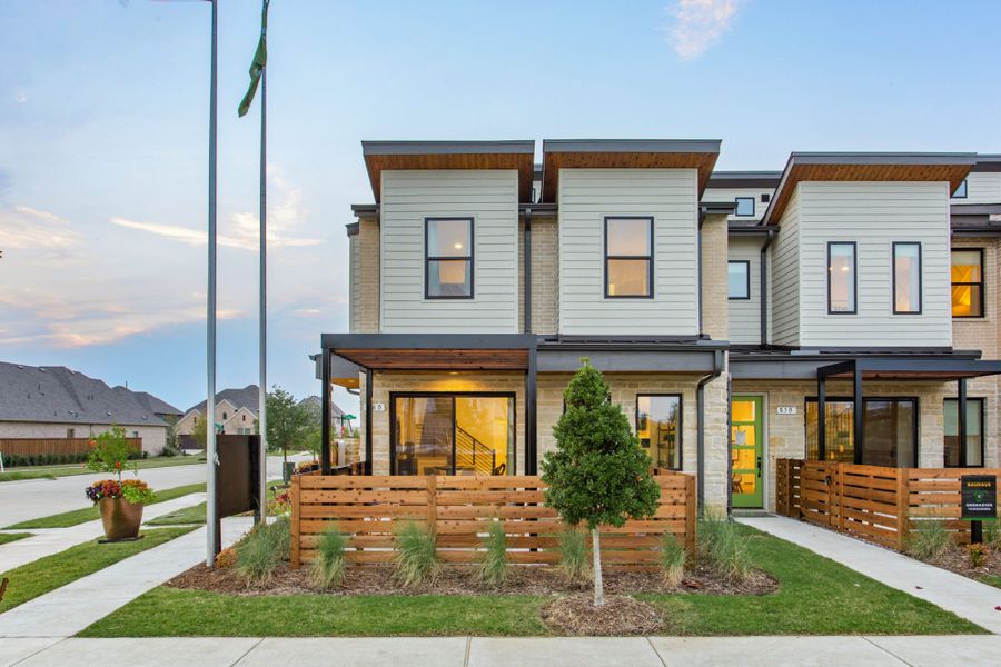 Front exterior of a home in the Windsong Ranch Townhomes community, located in Prosper, TX (Image 10).