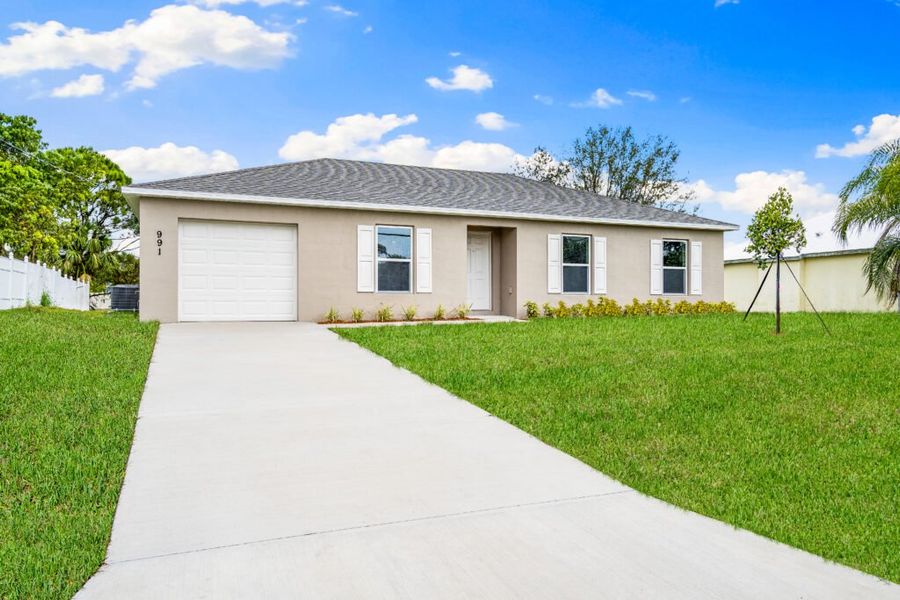 Front exterior of a home in the Palm Bay community, located in Palm Bay, FL (Image 2).