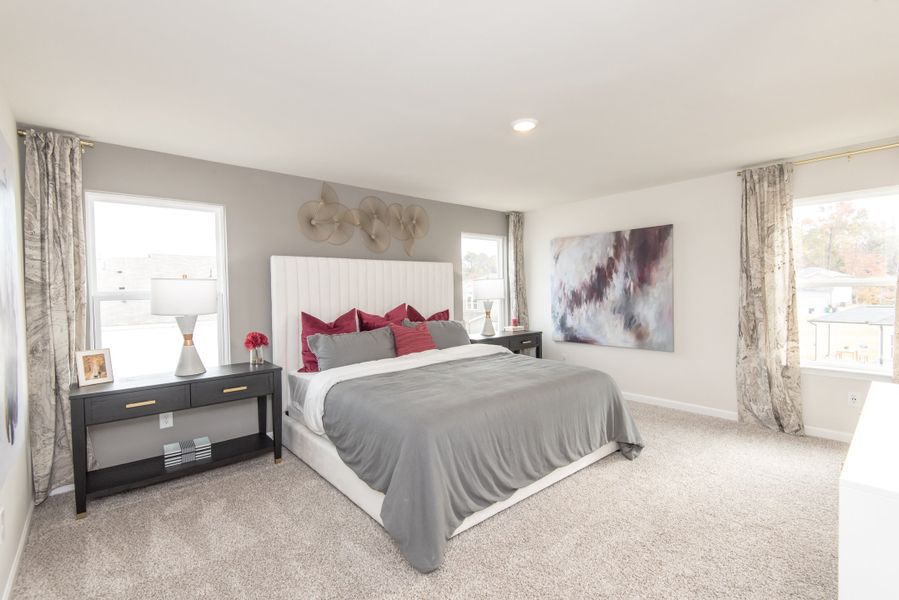 Step into your spacious and inviting master bedroom.