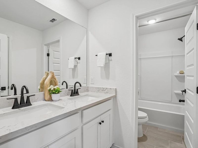 Furnished interior in a model home at Fairway Crossing in Converse (Image 17).