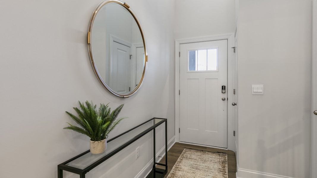 Furnished interior in a model home at The Meadows at Kinsley in Jamestown (Image 3).