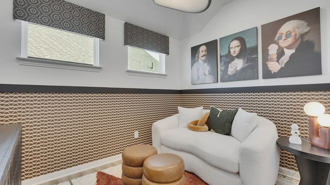 Geometric wallpaper and plush seating create a sophisticated aesthetic in this Spring Creek space.