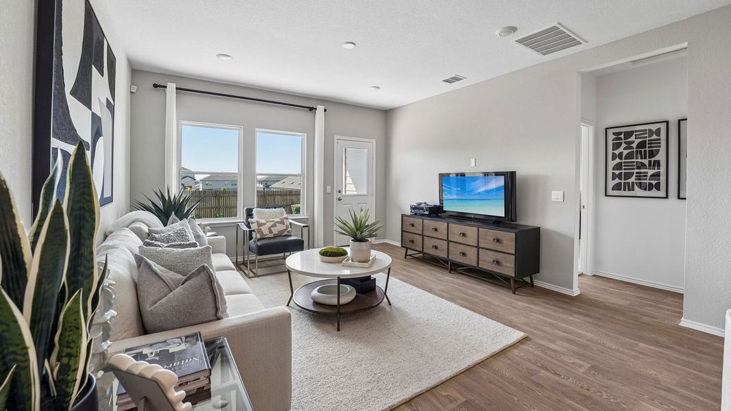 Furnished interior in a model home at Palomino in Manor (Image 9).