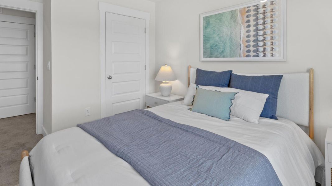 Furnished interior in a model home at Waterside Townhomes in Surf City (Image 27).