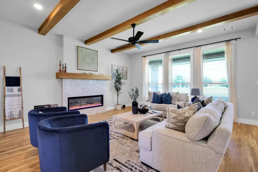 Furnished interior in a model home at Coppenger Place in Godley (Image 3).