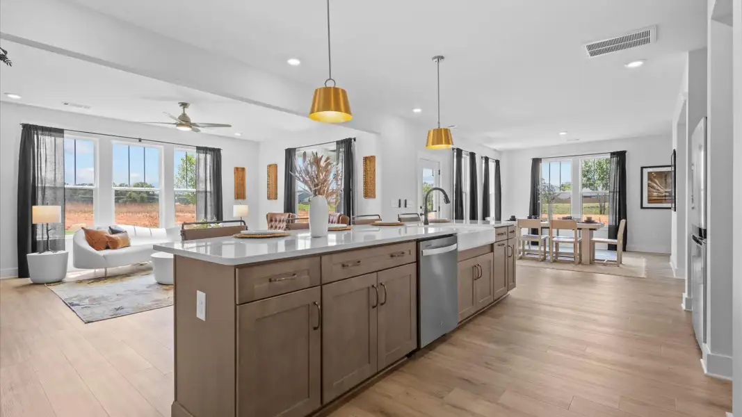 Luxury-inspired kitchen featuring expansive prep space and elegant design elements at the new Holliday Springs community