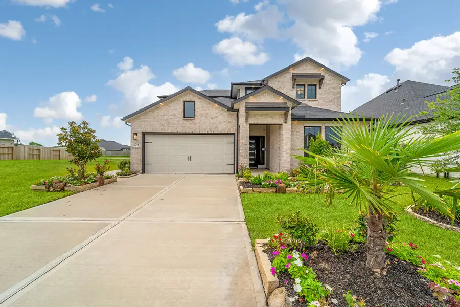 Front exterior of a home in the Mulberry Farms community, located in Santa Fe, TX (Image 8).