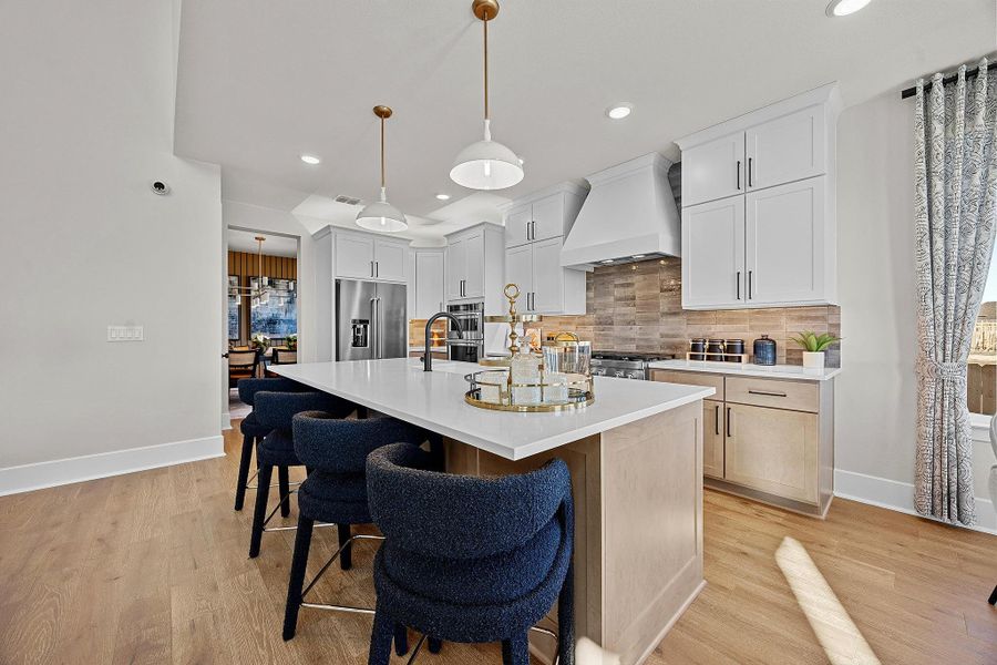 Furnished interior in a model home at New Haven - 60' in Manor (Image 7).