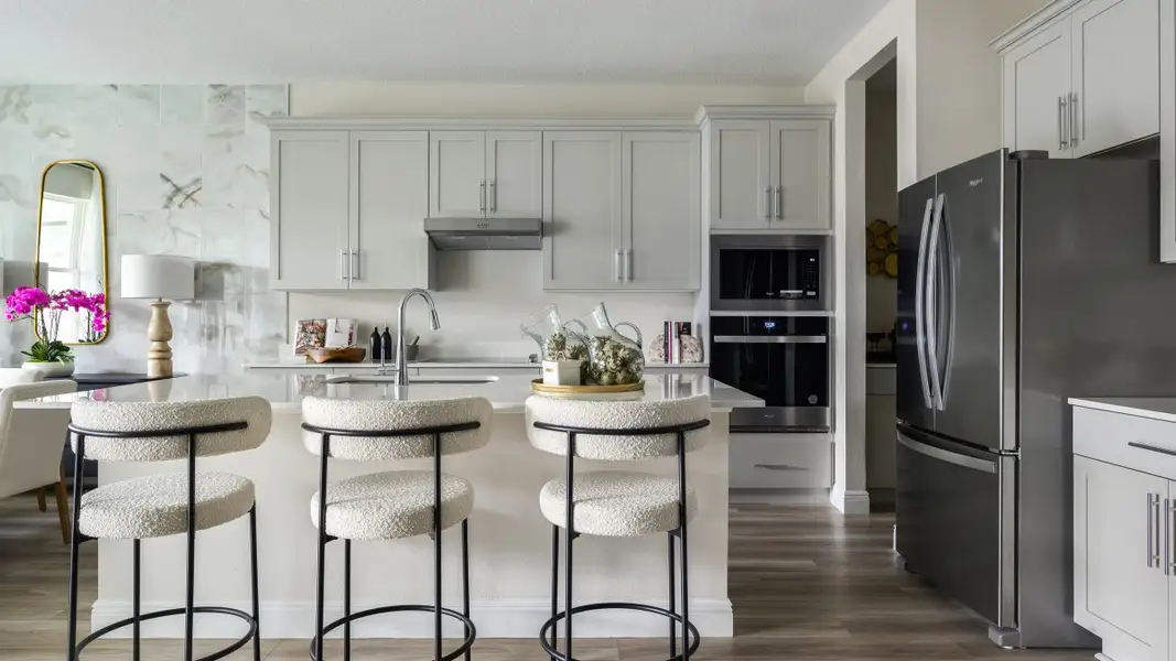 Furnished interior in a model home at Pasadena Woods in Dade City (Image 5).