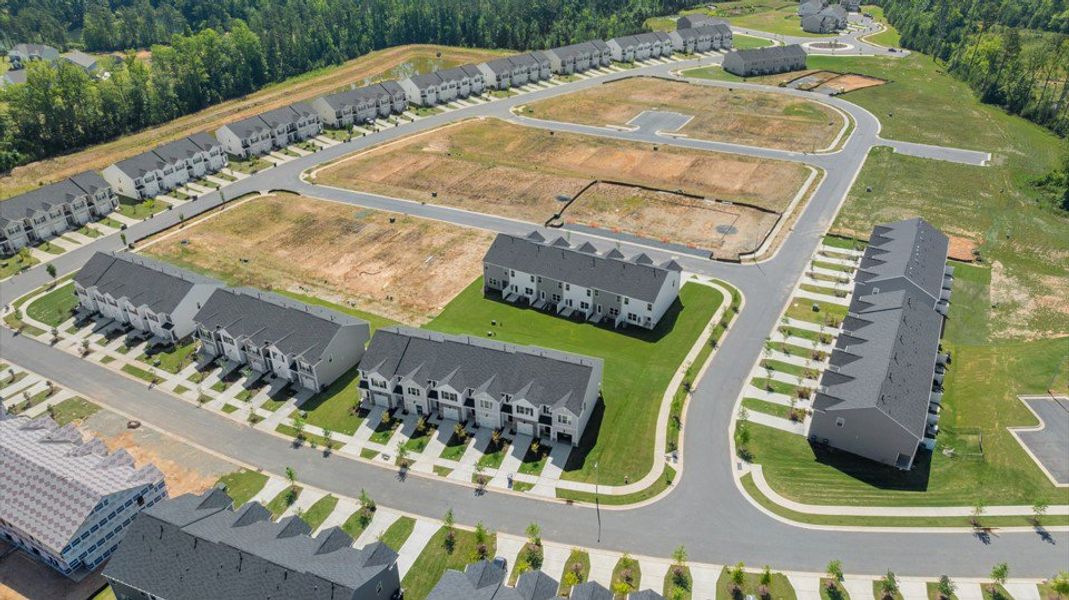 Aerial view of the The Townes at Galvins Ridge community in Sanford, NC, showing layout and nearby surroundings (Image 13). Aerial view of the The Townes at Galvins Ridge community in Sanford, NC, showing layout and nearby surroundings (Image 13).