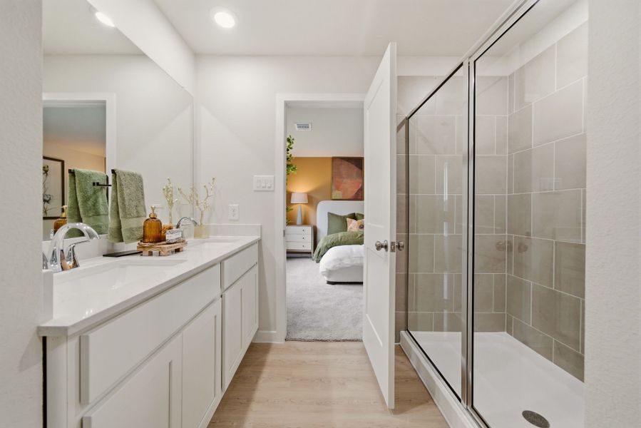 A bathroom with a glass shower.