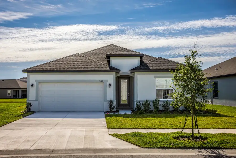 Front exterior of a home in the Central Park community, located in Port St. Lucie, FL (Image 2).