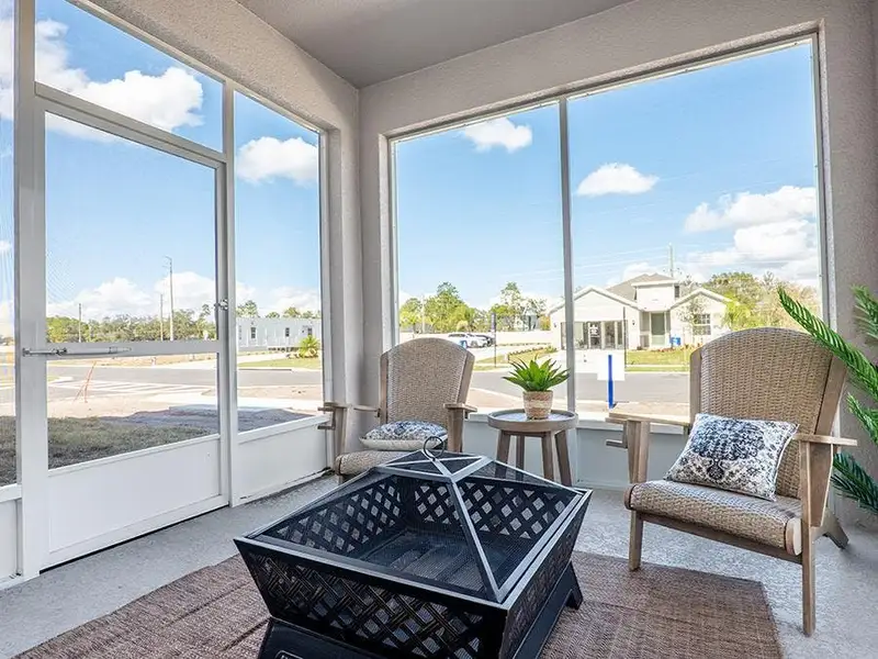 Your interior opens to desirable outdoor living space on a covered lanai - Aria model home in St. Cloud, FL Your interior opens to desirable outdoor living space on a covered lanai - Aria model home in St. Cloud, FL