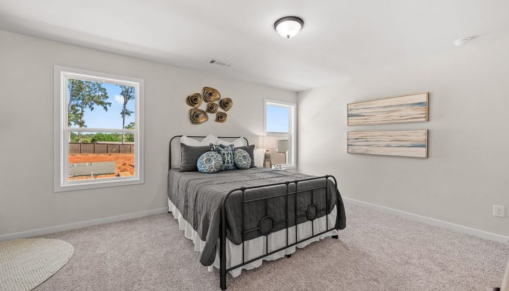 Furnished interior in a model home at Rosewood Lake Preserve in Hoschton (Image 34).