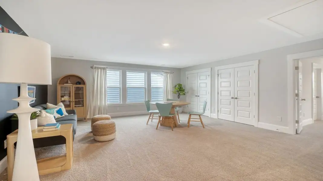Furnished interior in a model home at Wappetaw Woods in Awendaw (Image 11).