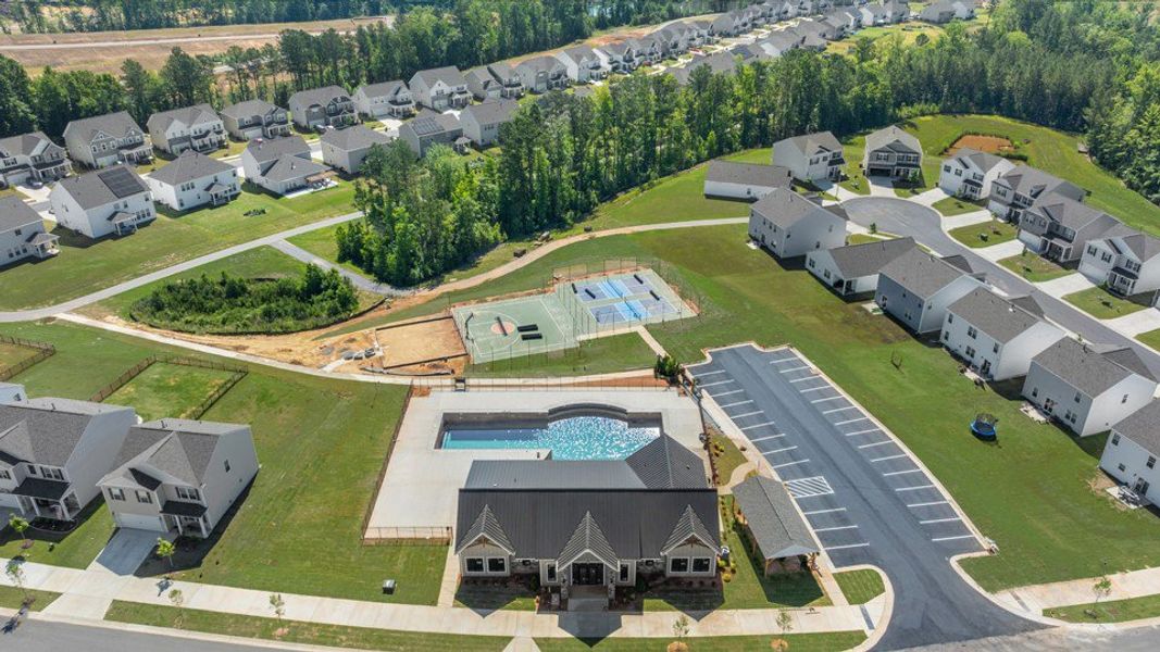 Aerial view of the The Townes at Galvins Ridge community in Sanford, NC, showing layout and nearby surroundings (Image 1). Aerial view of the The Townes at Galvins Ridge community in Sanford, NC, showing layout and nearby surroundings (Image 1).