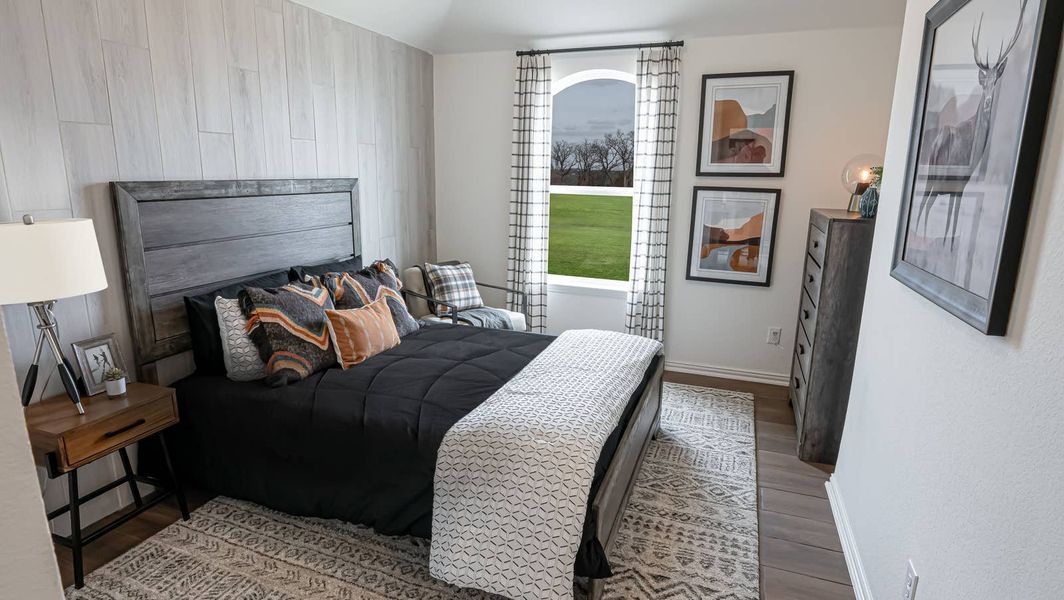 Furnished interior in a model home at High Country in Burleson (Image 7).