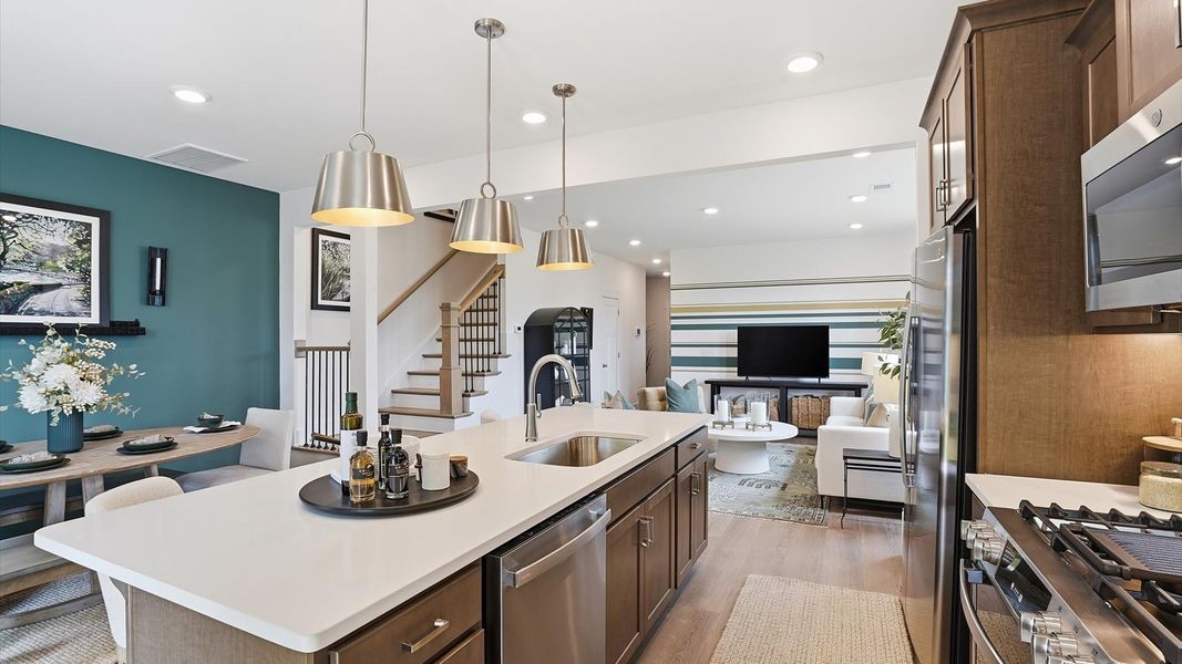 Exceptional kitchen featuring a spacious island, eye-catching pendant lights, and modern finishes in Simpsonville, SC Exceptional kitchen featuring a spacious island, eye-catching pendant lights, and modern finishes in Simpsonville, SC