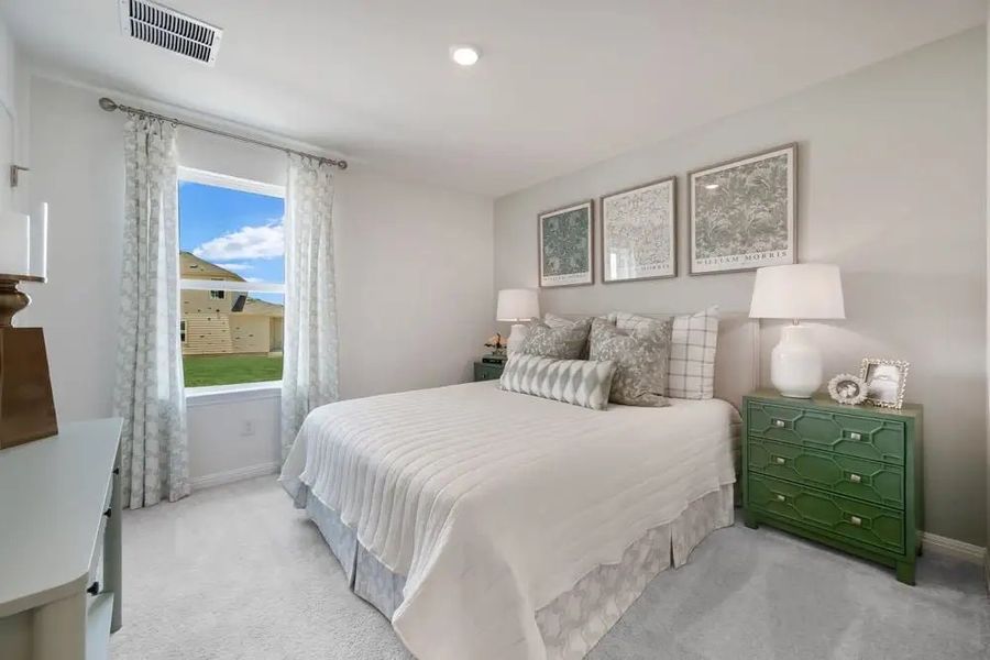 Furnished interior in a model home at Village Grove in Dripping Springs (Image 15).