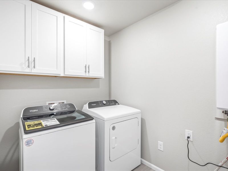 Laundry room in the Woodland floorplan at a Meritage Homes community in Broomfield, CO.