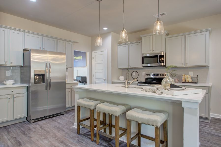 Furnished interior in a model home at Ellington Farms in Statham (Image 7).