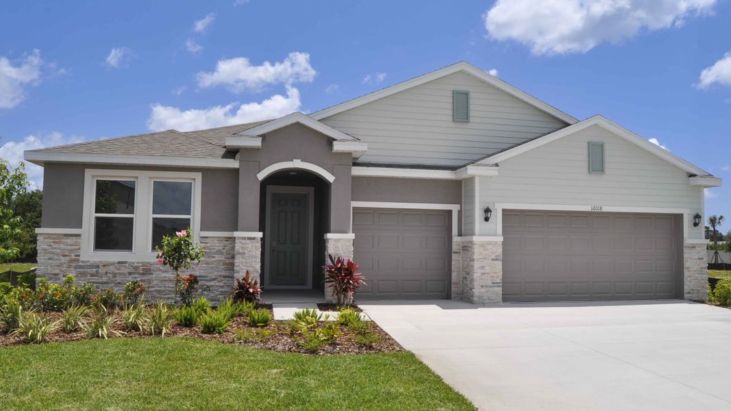 Front exterior of a home in the Oakfield Trails community, located in Parrish, FL (Image 1).