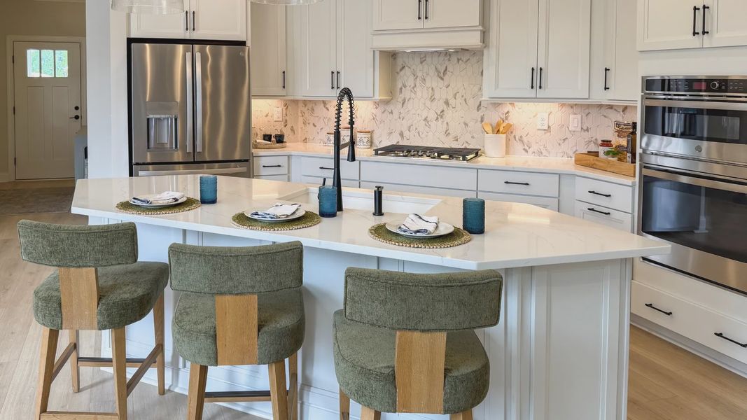 Furnished interior in a model home at The Courtyards at Hodges Farm in Charlotte (Image 37).