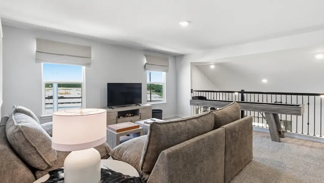 Furnished interior in a model home at The Woodlands at Medina Hills in Mico (Image 35).