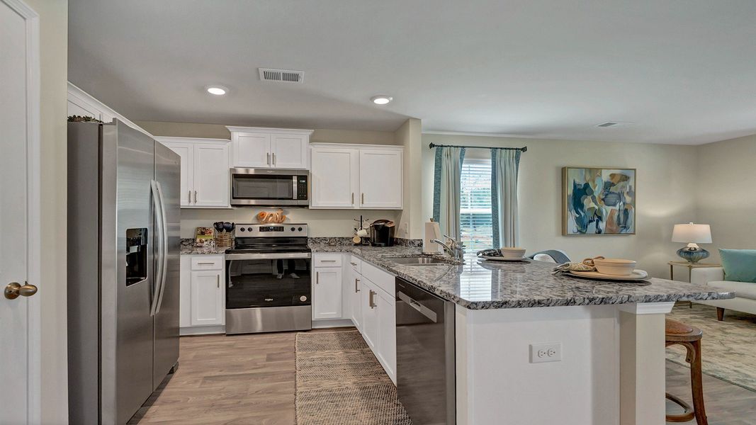 Furnished interior in a model home at Hunter's Branch Townhomes in Hopkins (Image 9).