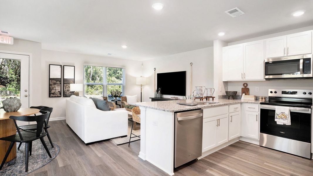 Furnished interior in a model home at The Townes at Amber Bluff in Conway (Image 5).