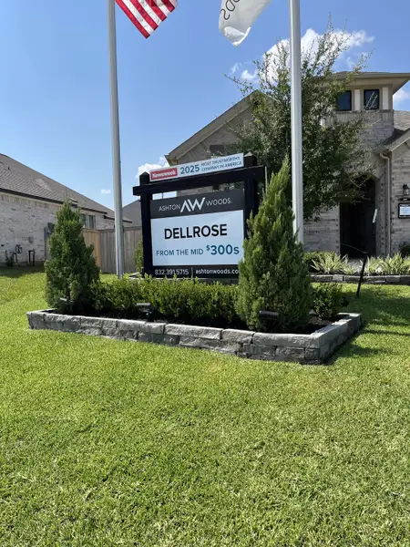 A beautiful brick home with a manicured lawn in Dellrose by Ashton Woods (Hockley, TX). A beautiful brick home with a manicured lawn in Dellrose by Ashton Woods (Hockley, TX).