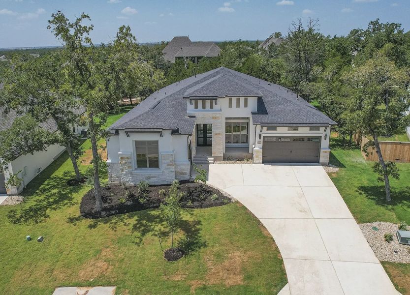 Front exterior of a home in the The Colony- Pine Cove community, located in Bastrop, TX (Image 3). Front exterior of a home in the The Colony- Pine Cove community, located in Bastrop, TX (Image 3).