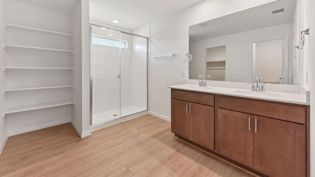 Furnished interior in a model home at Carillon in Manor (Image 9).
