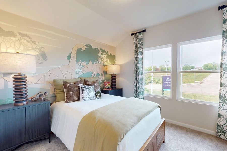 A bedroom with a bed and a window. A bedroom with a bed and a window.