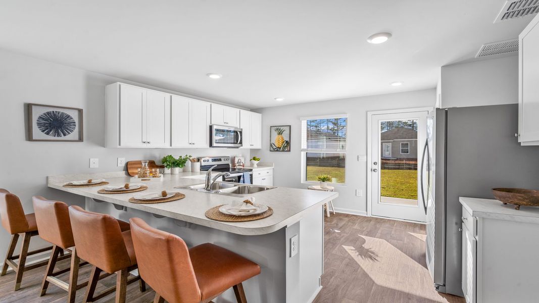 Furnished interior in a model home at Cobblestone Village in Savannah (Image 26).