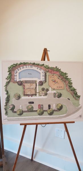 A community plan showcasing a pool, clubhouse, tot lot, and parking area.