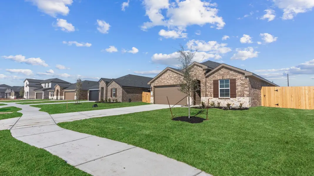 Front exterior of a home in the Caldwell Crossing community, located in Iowa Colony, TX (Image 8). Front exterior of a home in the Caldwell Crossing community, located in Iowa Colony, TX (Image 8).