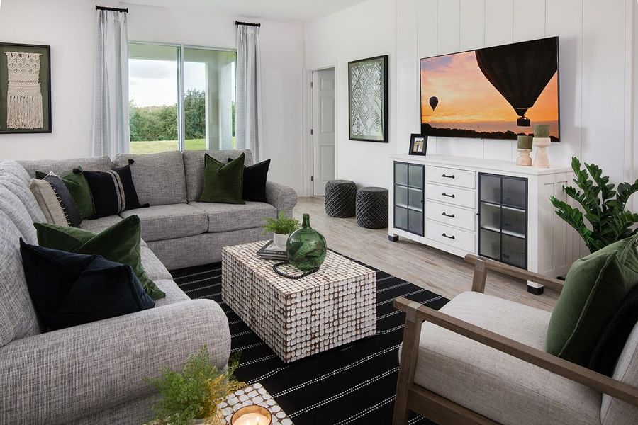 Furnished interior in a model home at Highfield at Twisted Oaks in Wildwood (Image 43).