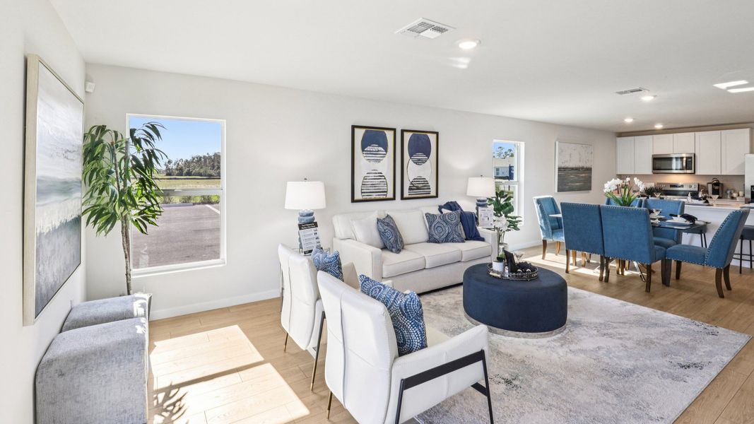 Furnished interior in a model home at Asher Park in Lehigh Acres (Image 14).